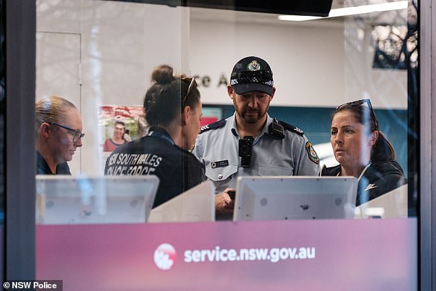 Police rushed to Service NSW office in Haymarket after an staff member was reportedly stabbed in broad daylight (pictured, police at the scene)