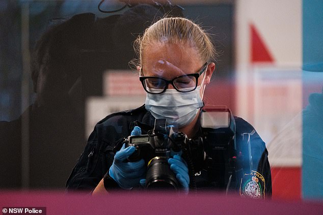 Forensic officers spent the afternoon scouring for evidence and taking photos of the scene