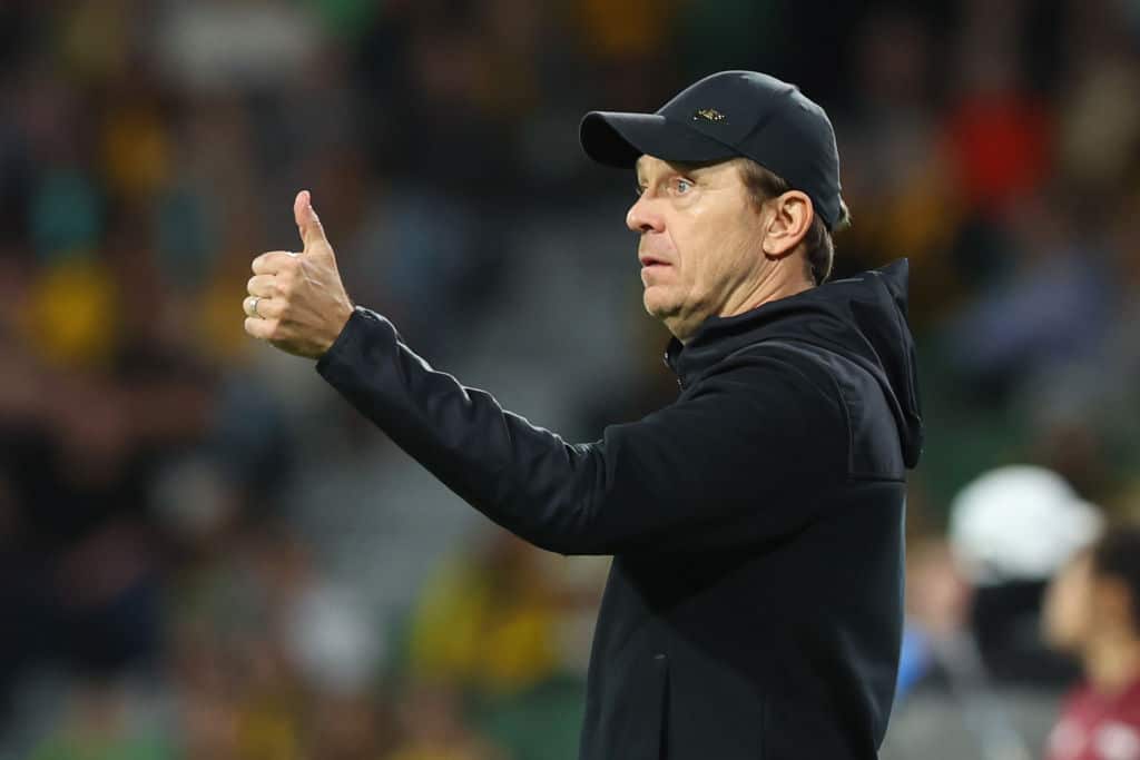 Tony Gustavsson, wearing a black hoodie and black cap, gives a thumbs up during a match