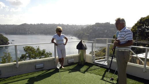 Former Australian Prime Minister Bob Hawke (R) and wife Blanche D'Alpuget on the golf putting green he has installed on top of his five story home in Northbridge, Sydney. Supplied by Dennis Rutzou Public Relations