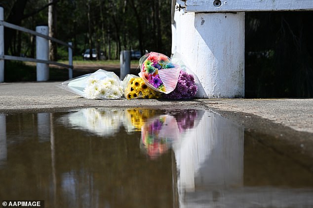 Flowers were left on the boat ramp near where the mother and her two children were first seen in the water