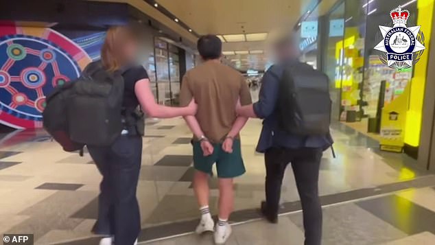 A 36-year-old man who was allegedly caught attempting to deposit $1 million of dirty money in a Brisbane bank was re-arrested and frogmarched through Sydney airport (pictured)