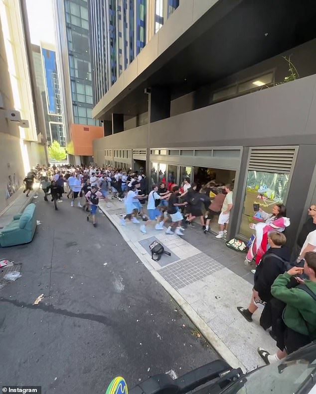 Footage of the mayhem, taken at pop-up store StreetX in Perth, showed hundreds of young people pushing their way into the shop as debris and a backpack went flying
