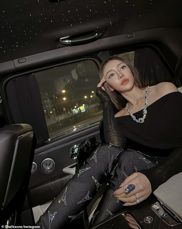 Shafira Huang flaunted her wealth online, including in this image taken in the back of a Rolls Royce. She is wearing the gold, sapphire and diamond necklace that was stolen