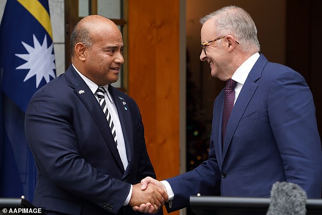 Nauru President David Adeang (left) and Australian Prime Minister Anthony Albanese shake hands during a press conference at Parliament House in December