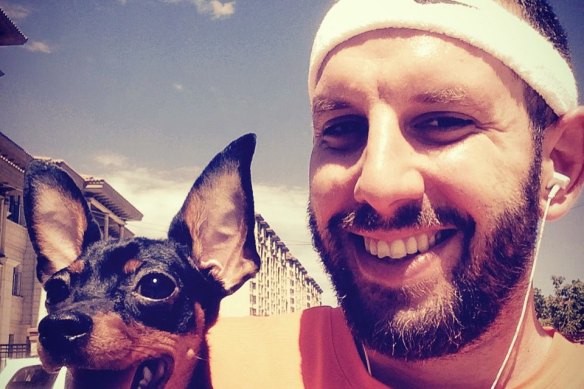 Matthew Radalj with his dog Mei Mei in Beijing before his arrest.