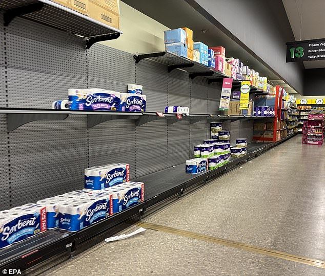Coles and Aldi are also shutting early on Friday in affected areas (pictured: Woolworths at Bribie Island on Wednesday)