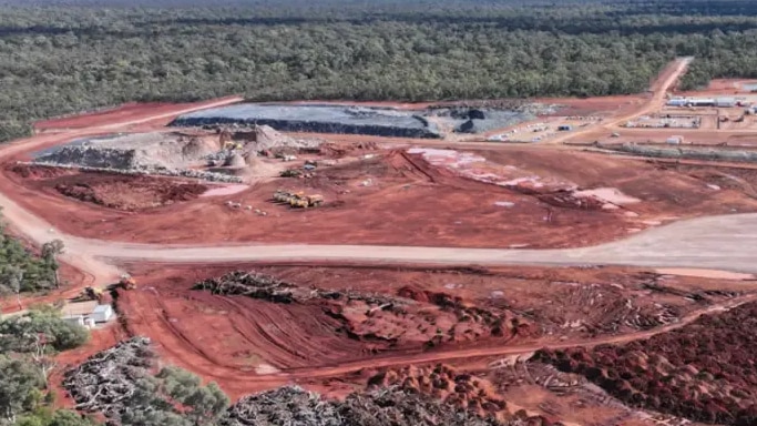 aerial shot of red earth mine site