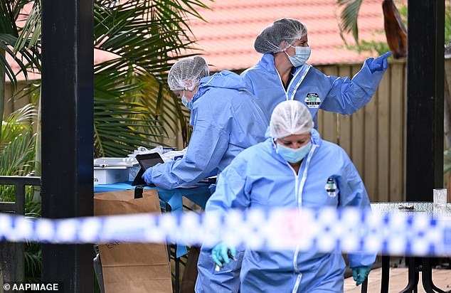 Forensics are seen at the home in Springfield Lakes on Saturday morning