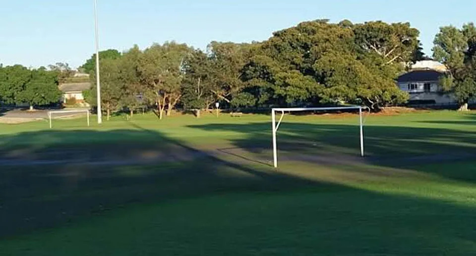 A sporting field covered in sewage. 