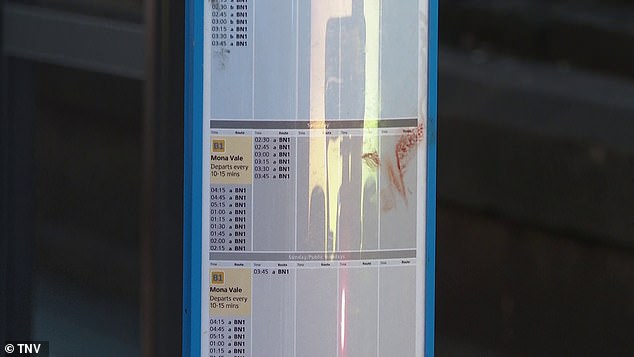 Blood is seen on a timetable at the stop on Carrington Street in Sydney's CBD