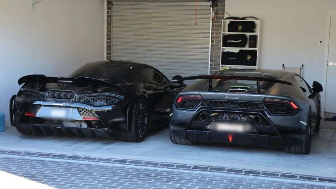 Another Lamborghini and a McLaren uncovered by officers during the operation. Picture: NSW Police