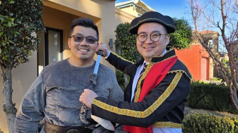 BigginScott Glen Waverley director Ming Xu, along with agency partner Eric Liu, dressed up as a bull and matador for a real estate auction - for herald sun real estate