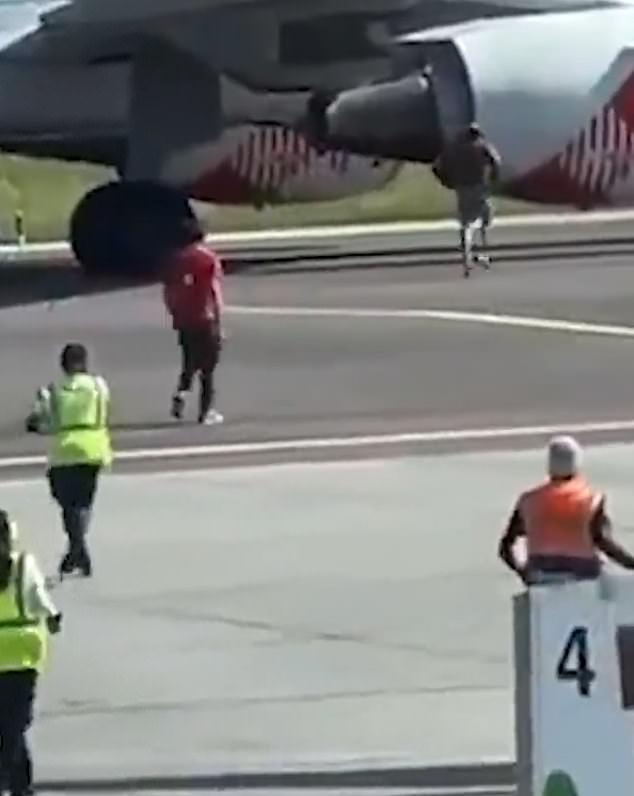 Russo was seen jogging towards the plane's starboard side, and jumping at the side of the jet engine