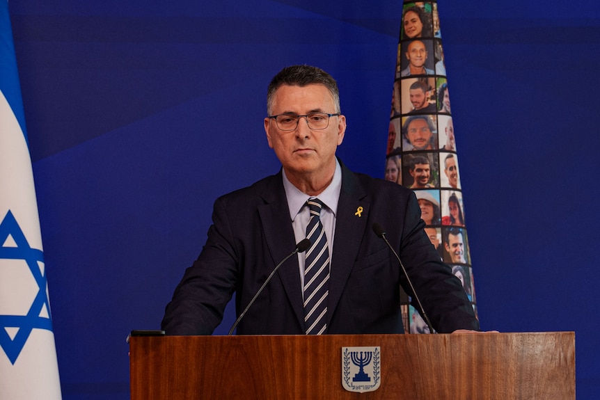 Israel's foreign minister speaking at a press conference from a lectern.