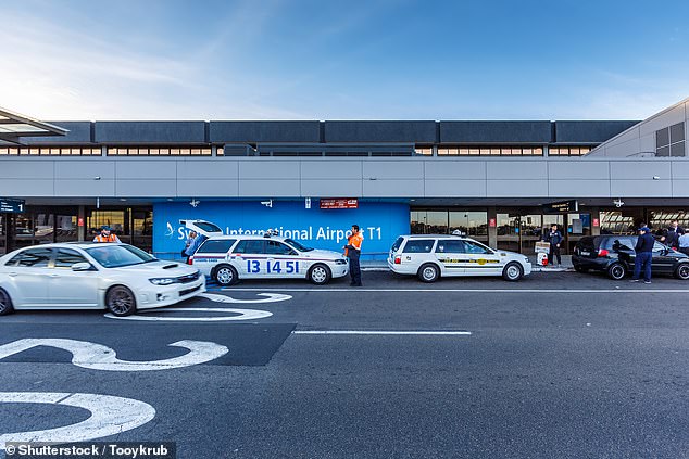 Taxis line up outside the departure terminal at Sydney Airport