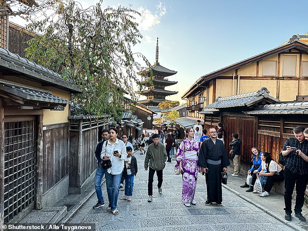Australians planning to visit the Japanese city of Kyoto will be forced to pay an increased tourist tax from March, 2026 (pictured tourists in one of Kyoto's main streets)