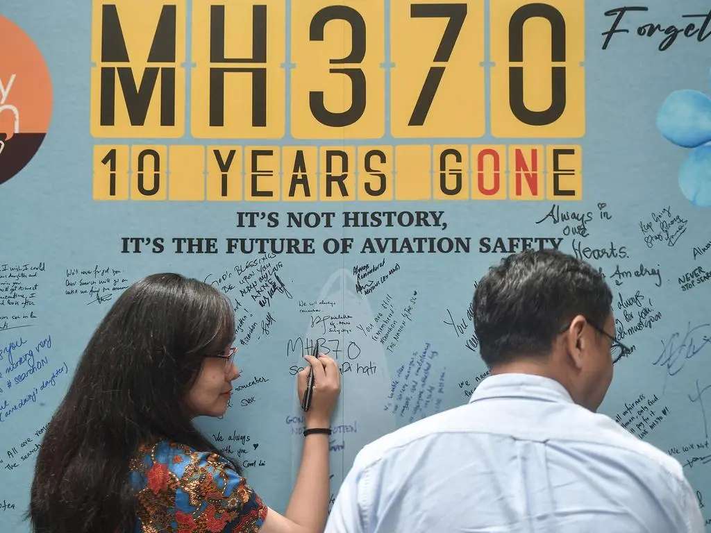 MH370 消失在航线上并与空中交通管制团队失去联系已有 10 年。图片来源：Arif Kartono / AFP