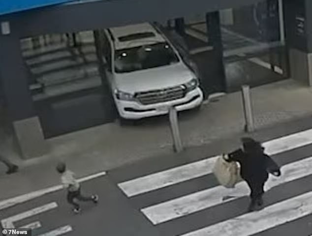 Children could be seen running away as the car hurtled through the centre