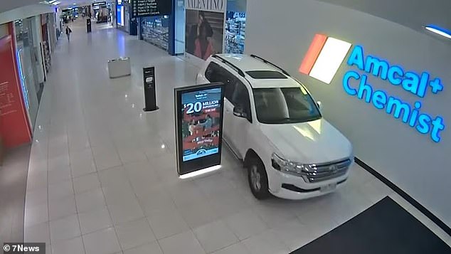 The car narrowly avoided people as it sped through the notorious mall