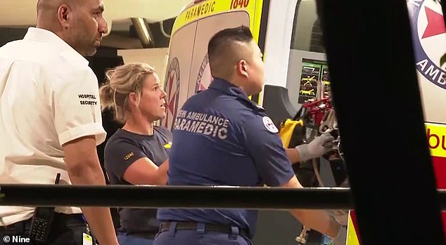 A man who presented himself to hospital with gunshot and stab wounds remains in a serious condition