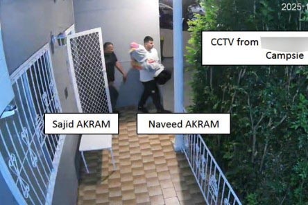 Two men carrying covered firearms.