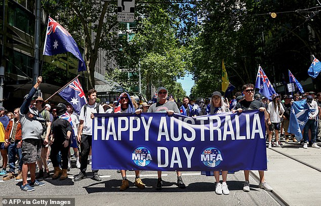 Anti-government protesters take part in a rally on a road on Australia Day in Melbourne on January 26, 2026. (Photo by Izhar KHAN / AFP via Getty Images)