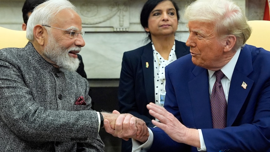 Donald Trump shakes hands with India's Prime Minister Narendra Modi in the Oval Office.
