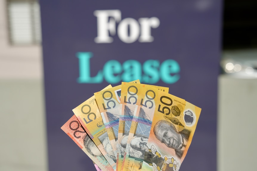 Cash and a for lease sign.