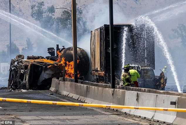 More photos of members of the Chilean Fire Department containing the fire caused by the gas explosion