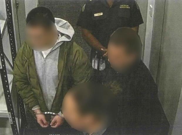 Image for Traveller being escorted