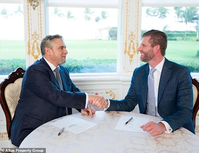Pictured, executive vice president of the Trump Organization Eric Trump (right) and Altus chief executive David Young (left) sign the deal