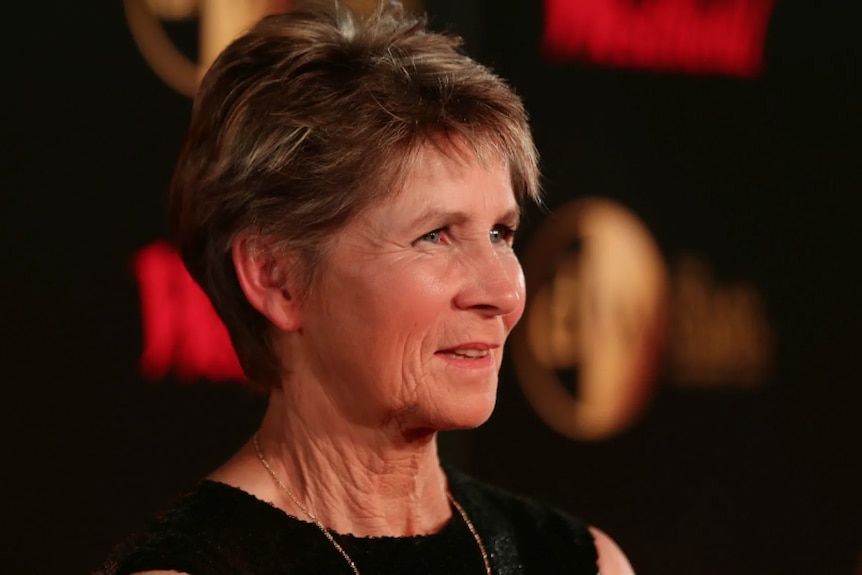 A middle aged women looking forward