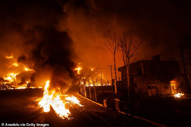 Oil prices have risen due to disruptions in the Strait of Hormuz, with Iran blocking access following US-Israel airstrikes on the nation (pictured, an oil depot up in flames in Iran)