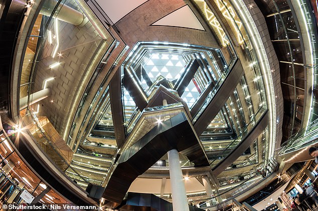 One employee said colleagues were afraid to stand near the atrium in the middle of the 14-storey Docklands building (pictured), describing it as a 'love letter to staff to end their lives'