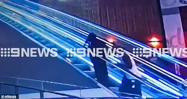 A passer-by assisted the young childcare worker, who suffered serious upper body injuries after she was followed onto an escalator and allegedly stabbed (pictured)