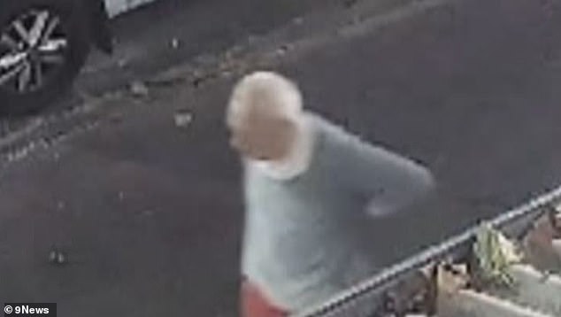 The elderly man was captured on CCTV holding his hands to his lower back as he slowly made his way to a nearby cafe to seek help (pictured)