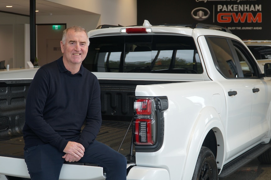 a man sitting on an ute