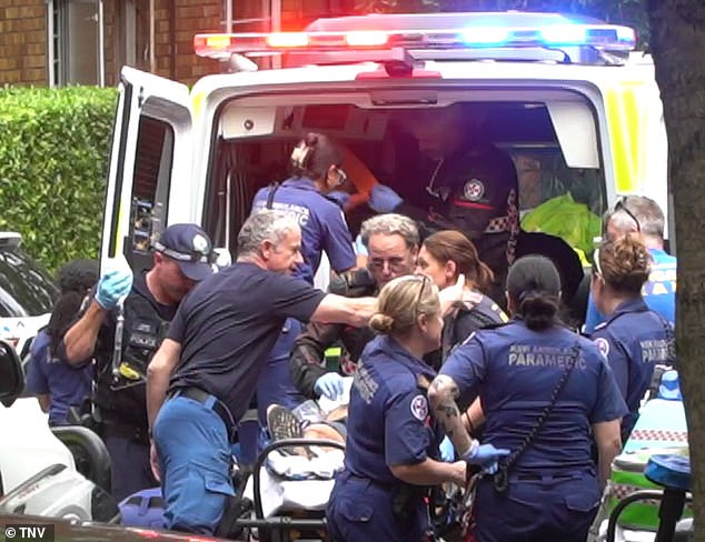 Paramedics take one of the victims to hospital