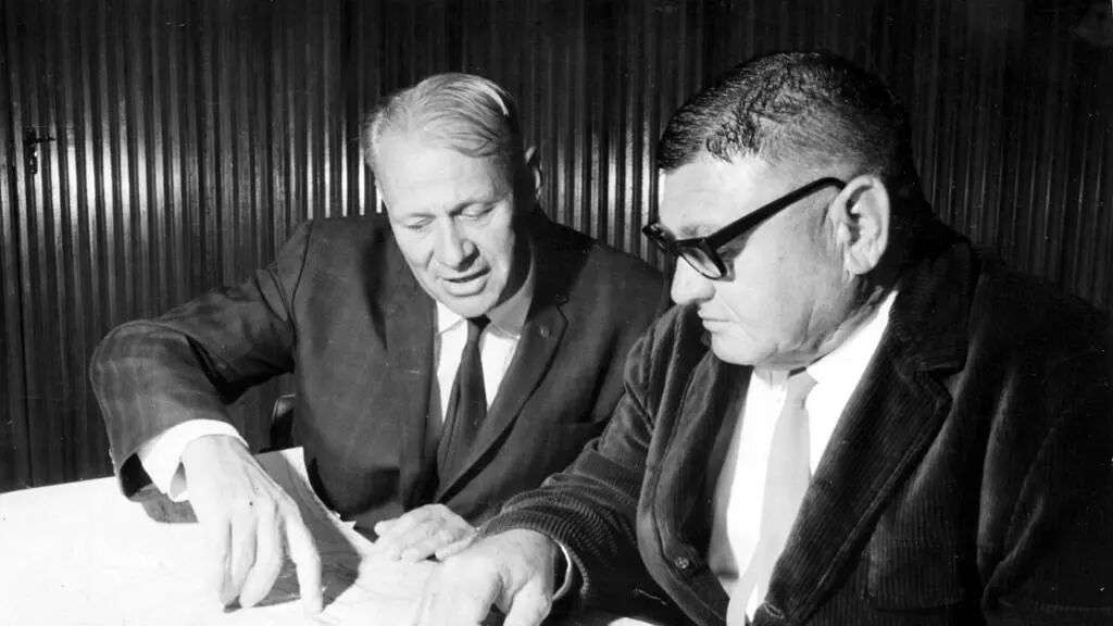 Western Australian iron ore pioneers Peter Wright and Lang Hancock work on a Map Of The Hamersley in the Pilbara in 1970. Picture: Supplied