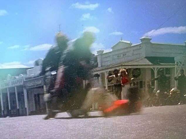 A man is dragged behind a motorbike through the township of Clunes in the Australian classic Mad Max