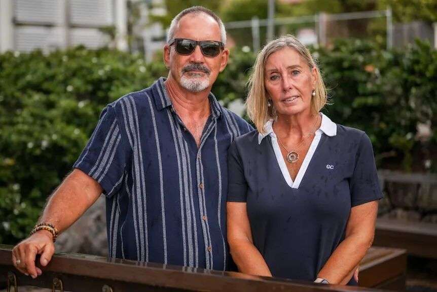 A man and woman stand beside each other.